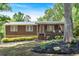 Charming single-story home featuring a welcoming front porch and nicely landscaped front yard at 6863 Recreation Ln, Acworth, GA 30102