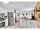 Open kitchen featuring stainless steel appliances and granite countertops at 6863 Recreation Ln, Acworth, GA 30102