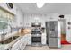Well-appointed kitchen showcasing granite counters, stainless appliances, and white cabinetry at 6863 Recreation Ln, Acworth, GA 30102
