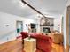 Comfortable living room featuring a brick fireplace, hardwood floors, and inviting furnishings at 6863 Recreation Ln, Acworth, GA 30102