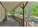 Relaxing covered porch with comfortable seating, offering a tranquil outdoor living space at 6863 Recreation Ln, Acworth, GA 30102