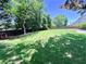 The home features a large backyard with a green lawn at 2130 Chattahoochee Dr, Duluth, GA 30097