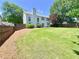 Large backyard with a green lawn and privacy fence at 2130 Chattahoochee Dr, Duluth, GA 30097