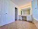 Bathroom features vanity, double sinks, decorative lighting, and tile flooring at 2130 Chattahoochee Dr, Duluth, GA 30097