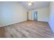 Spacious bedroom with ceiling fan and hardwood floors, adjacent to bathroom at 2130 Chattahoochee Dr, Duluth, GA 30097
