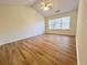 Bright bedroom featuring vaulted ceiling, wood floors, and natural light at 2130 Chattahoochee Dr, Duluth, GA 30097