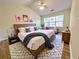 Comfortable bedroom featuring a vaulted ceiling, ceiling fan, and a large window at 2130 Chattahoochee Dr, Duluth, GA 30097
