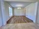 Bright dining area, neutral paint, chandelier and classic wainscoting detail at 2130 Chattahoochee Dr, Duluth, GA 30097