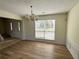 Dining area with natural light, neutral tones, and classic wainscoting detail at 2130 Chattahoochee Dr, Duluth, GA 30097