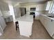 Modern kitchen with white cabinets, stainless steel appliances, and center island at 2130 Chattahoochee Dr, Duluth, GA 30097