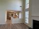 Open living area showcasing kitchen and fireplace, filled with natural light at 2130 Chattahoochee Dr, Duluth, GA 30097