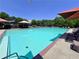 A community swimming pool offers residents a refreshing escape and a place to relax with ample seating and sunshades at 2130 Chattahoochee Dr, Duluth, GA 30097