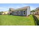 Spacious backyard featuring a well manicured lawn and partial fence at 302 Bunker Hill Ct, Acworth, GA 30102