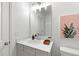 Clean bathroom with light grey vanity, quartz countertops, and modern fixtures at 302 Bunker Hill Ct, Acworth, GA 30102