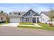 Charming home featuring a manicured lawn, well-placed shrubs and attached two car garage at 302 Bunker Hill Ct, Acworth, GA 30102