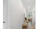 Hallway leading to the living area with light hardwood floors and light, neutral decor at 302 Bunker Hill Ct, Acworth, GA 30102