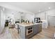 Modern kitchen featuring a central island, stainless appliances, and an open layout to the comfortable living space at 302 Bunker Hill Ct, Acworth, GA 30102