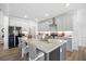 Spacious kitchen with a large island, bar seating, granite countertops, and stainless steel appliances at 302 Bunker Hill Ct, Acworth, GA 30102