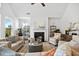Cozy living room with fireplace, high ceilings, and neutral decor at 302 Bunker Hill Ct, Acworth, GA 30102