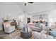 Bright, open living room with stylish furnishings and a view into the modern kitchen at 302 Bunker Hill Ct, Acworth, GA 30102
