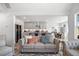 Comfortable living room features neutral tones and an open layout, flowing seamlessly into the kitchen and dining area at 302 Bunker Hill Ct, Acworth, GA 30102