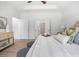Bright main bedroom with tray ceiling, fan, and access to bathroom and walk-in closet at 302 Bunker Hill Ct, Acworth, GA 30102