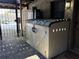 Backyard patio featuring storage shed, wrought iron gate, and door to the home at 375 6Th Ne St # 5, Atlanta, GA 30308