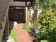 The backyard features a brick pathway, garden, and wooden fence for privacy at 375 6Th Ne St # 5, Atlanta, GA 30308