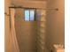 This bathroom features a tiled shower with glass block wall and updated fixtures at 375 6Th Ne St # 5, Atlanta, GA 30308
