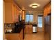 Well-equipped kitchen boasting stainless steel appliances, a stylish backsplash, and wooden cabinets at 375 6Th Ne St # 5, Atlanta, GA 30308