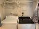 Laundry room featuring a washer, dryer, wire shelving, and convenient electrical outlets at 375 6Th Ne St # 5, Atlanta, GA 30308