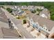 Aerial view of townhomes in a residential area with easy access to community streets and parking at 4173 Chatham Ridge Dr, Buford, GA 30518