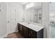Beautiful bathroom features a white marble countertop, dark cabinets, and modern fixtures at 4173 Chatham Ridge Dr, Buford, GA 30518