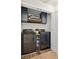 Efficient laundry room featuring modern washer and dryer with stylish overhead cabinetry and decorative elements at 4173 Chatham Ridge Dr, Buford, GA 30518