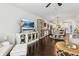 Open concept living area seamlessly connects the dining area, kitchen, and Gathering room with hardwood flooring at 4173 Chatham Ridge Dr, Buford, GA 30518