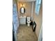 Bathroom with a vanity, framed oval mirror, toilet, window and shower curtain at 6540 Old White Mill Road Rd, Fairburn, GA 30213