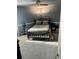 Cozy bedroom with carpet, ceiling fan and light, bed, and gray walls at 6540 Old White Mill Road Rd, Fairburn, GA 30213