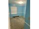 Bedroom with baby blue paint, carpet, and a window with blinds at 6540 Old White Mill Road Rd, Fairburn, GA 30213