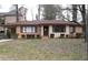 Charming single-story brick home with a cozy covered carport, well-maintained landscaping, and a welcoming entrance at 1253 Dunwoody Ne Ln, Brookhaven, GA 30319