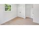 Bedroom featuring hardwood floors, closet, and window at 2105 Royal Fox Way, Decatur, GA 30032
