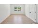 Empty bedroom with hardwood floors and natural light at 2105 Royal Fox Way, Decatur, GA 30032