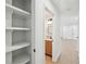 View of the updated hallway and half-bath, with light wood floors at 2105 Royal Fox Way, Decatur, GA 30032