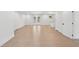 Bright living room with wood floors, fresh white paint, glass patio doors, and kitchen counter pass-through at 2105 Royal Fox Way, Decatur, GA 30032