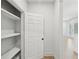 Walk-in pantry with built-in shelving and hardwood floors at 2105 Royal Fox Way, Decatur, GA 30032