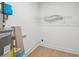 Utility room with hardwood floors, water heater and white walls at 2105 Royal Fox Way, Decatur, GA 30032