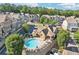 Aerial view of neighborhood, pool, and surrounding greenery at 238 Trecastle Sq, Canton, GA 30114