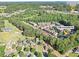 Aerial shot of the home's location with nearby school, golf course and shopping at 238 Trecastle Sq, Canton, GA 30114