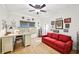 Bedroom with bright window, ceiling fan, and a red sofa at 238 Trecastle Sq, Canton, GA 30114