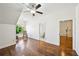 Bright bedroom featuring hardwood floors, a ceiling fan, and neutral walls at 238 Trecastle Sq, Canton, GA 30114