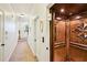 Hallway featuring an elevator with wood paneled interior and decorative details at 238 Trecastle Sq, Canton, GA 30114